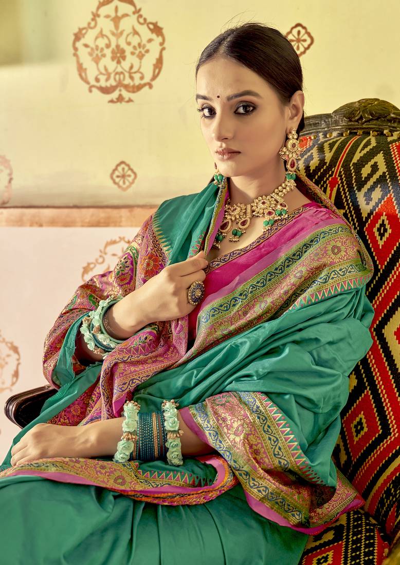 Sea green plain banarasi silk saree with blouse