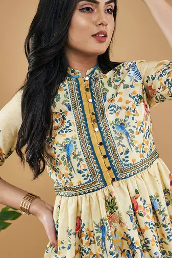 Yellow bird and tile printed peplum top with drape skirt