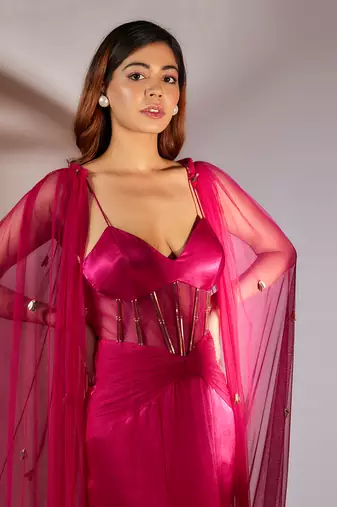 Hot pink embroidered gown with cape