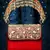 coffer red & gold stone work embellished velvet purse clutch