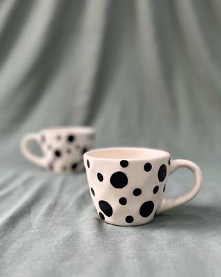 Whimsical Delight: Handmade Ceramic Mug  with Contrasting Black Polka Dots on Ivory-White Background 1