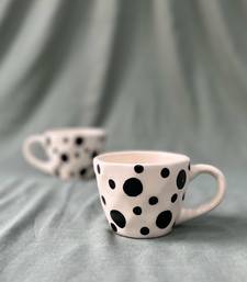 Whimsical Delight: Handmade Ceramic Mug  with Contrasting Black Polka Dots on Ivory-White Background