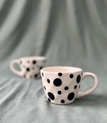 Whimsical Delight: Handmade Ceramic Mug  with Contrasting Black Polka Dots on Ivory-White Background