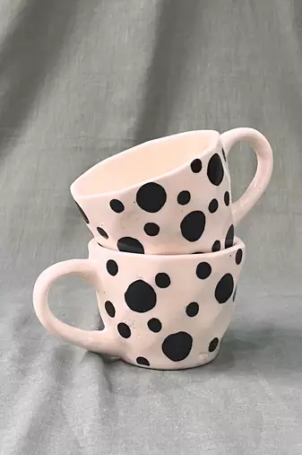 Whimsical Delight: Handmade Ceramic Mug  with Contrasting Black Polka Dots on Ivory-White Background
