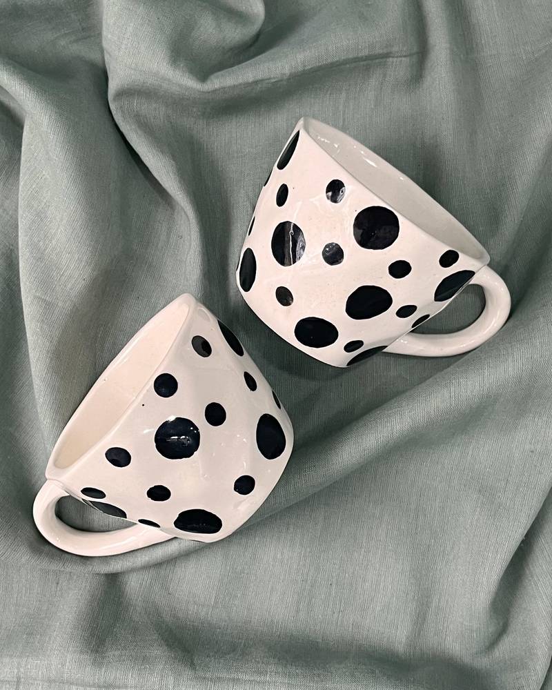 Whimsical Delight: Handmade Ceramic Mug  with Contrasting Black Polka Dots on Ivory-White Background