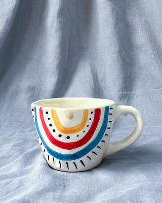 Radiant Spectrum: Hand-Painted, Hand-Glazed Ivory White Mug with Vibrant Rainbow Colors 1