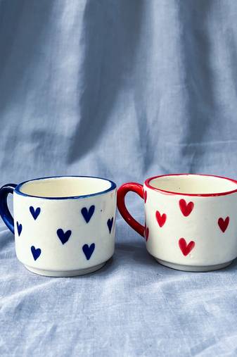 Heartfelt Elegance: Ivory White Mug with Blue Heart, Blue Rim, and Blue Handle