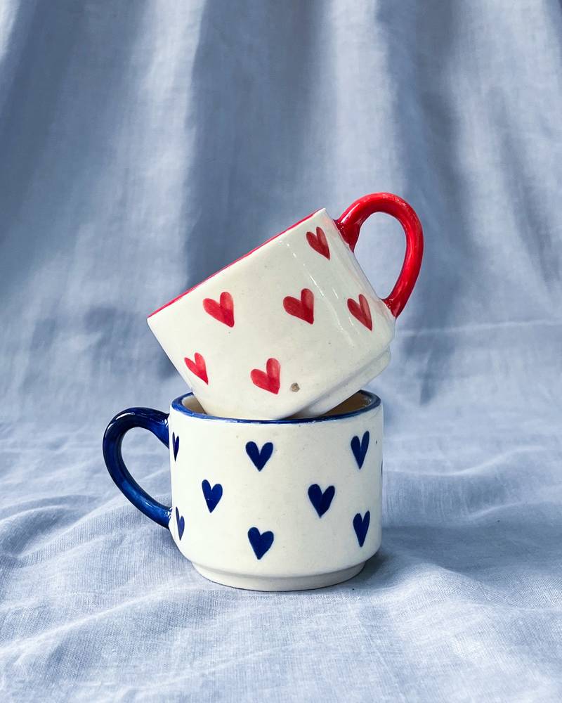 Heartfelt Elegance: Ivory White Mug with Blue Heart, Blue Rim, and Blue Handle