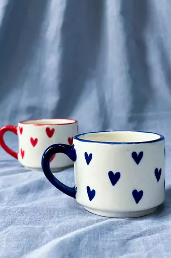Heartfelt Elegance: Ivory White Mug with Blue Heart, Blue Rim, and Blue Handle
