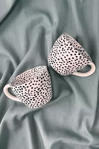 Whimsical Dot Dance: Handmade Ceramic Mug with Contrasting Polka Dots
