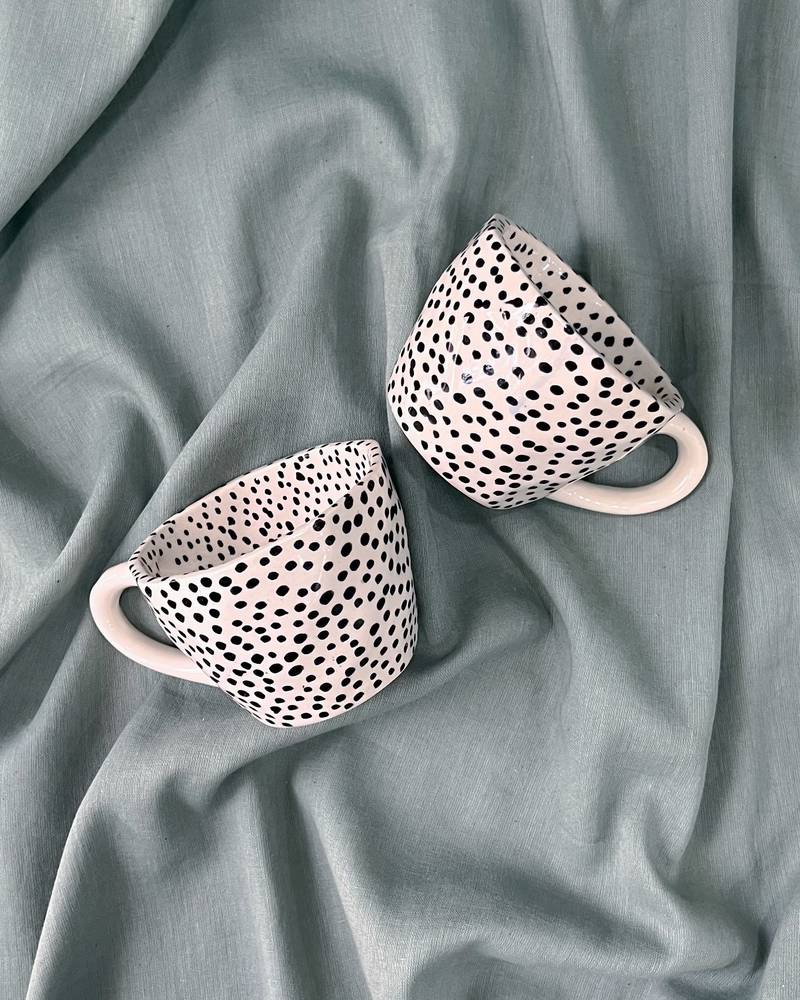 Whimsical Dot Dance: Handmade Ceramic Mug with Contrasting Polka Dots