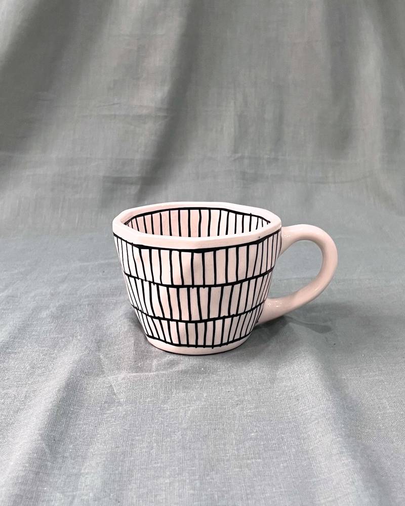 Urban Chic: Handcrafted Ceramic Mug with Brick Design Inside and Outside in Black on Ivory-White Background