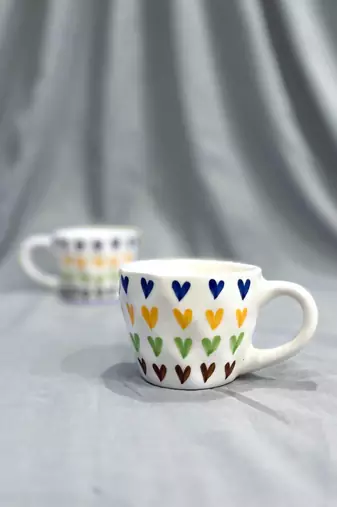 Passionate Delight: Hand-Painted, Hand-Glazed Ivory White Mug with Vibrant and Bold Hearts