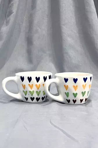 Passionate Delight: Hand-Painted, Hand-Glazed Ivory White Mug with Vibrant and Bold Hearts