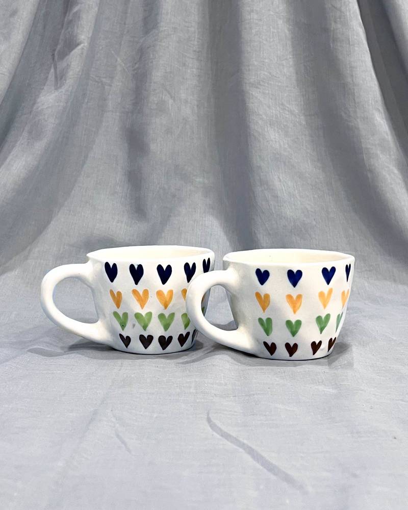 Passionate Delight: Hand-Painted, Hand-Glazed Ivory White Mug with Vibrant and Bold Hearts