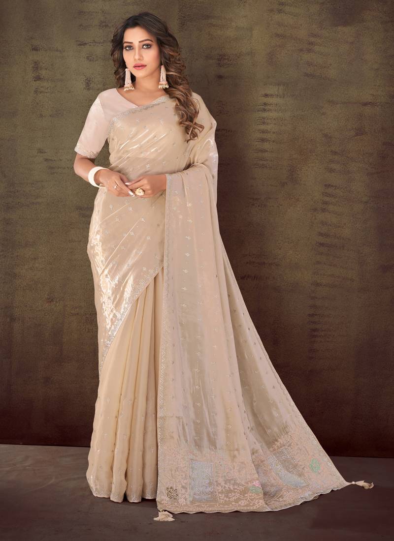 Cream organza silk georgette heavy embroidered saree with unstitched blouse piece