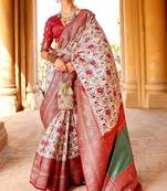 Luxuriant Off-White Woven Patola Silk Saree with Classic Border