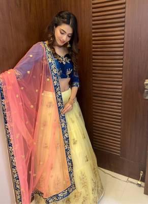 yellow embroidered net semi stitched lehenga 6