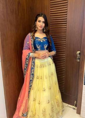 yellow embroidered net semi stitched lehenga 7
