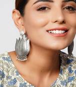 Silver oxidized lotus stud earrings with ghungroo