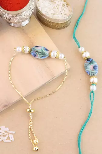 I jewels rakshabhandhan special peacock feather beaded bhaiya bhabhi chain lumba bracelet rakhi combo set with roli