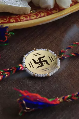 Golden Beaded Swastik Rakhi