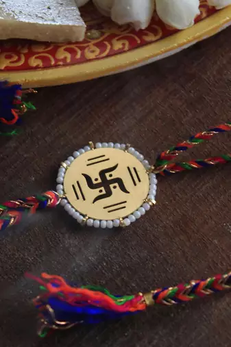 Golden Beaded Swastik Rakhi