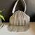 Silver dangling tassel embellished potli bag