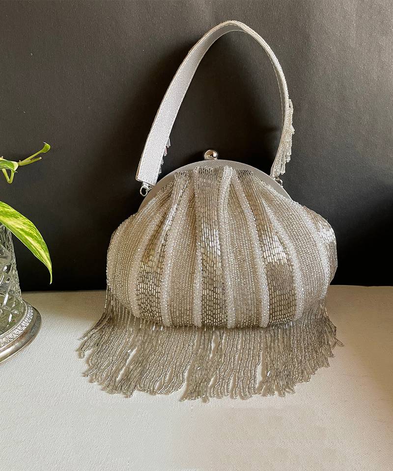 Silver dangling tassel embellished potli bag
