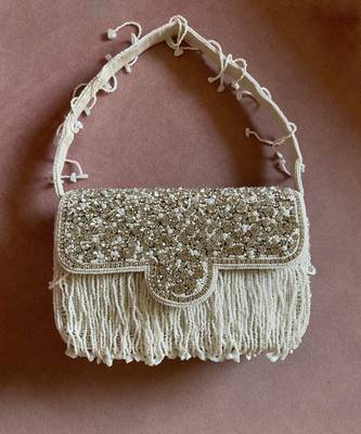White & silver studded tassel bucket bag 1