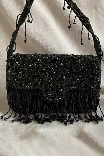 Black studded tassel bucket bag