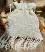 White dangling tassel embellished potli bag