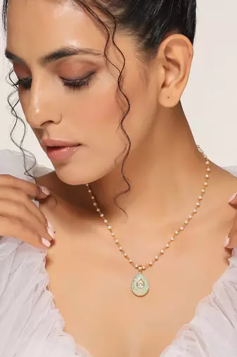 Green gold tone kundan pendant with chain