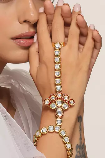 Red gold tone kundan hathphool