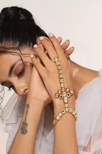 Red gold tone kundan hathphool