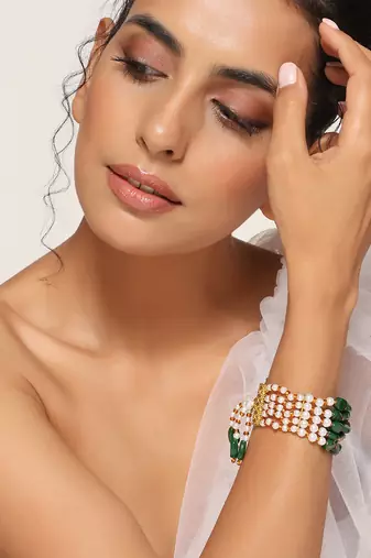 Green and white gold tone pearl bracelet