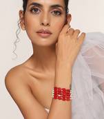 Red and white gold tone pearl bracelet