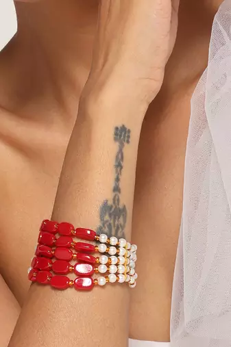 Red and white gold tone pearl bracelet
