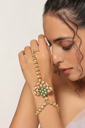 Green gold tone kundan hathphool