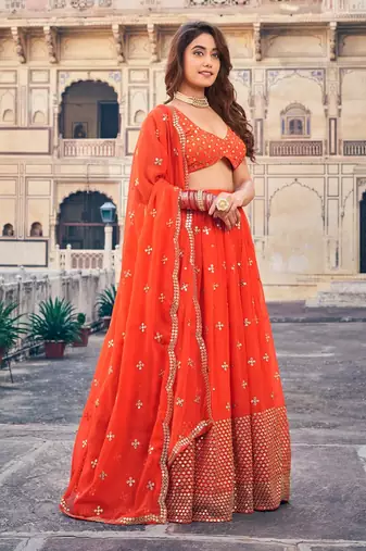 Orange Sequine Embroidered Work Georgette Fabric Wedding Lehenga Choli With Dupatta Semi Stitched.