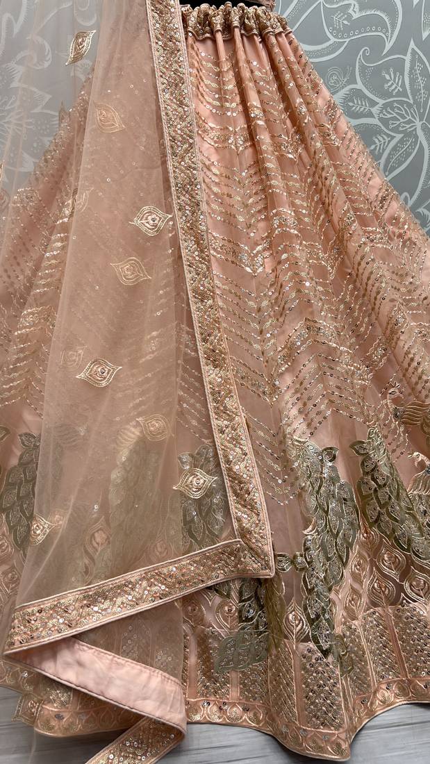 Delightful Peach Sequins Zari And Thread Embroidered Net Wedding & Party Lehenga