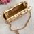 Beige embroidered ada capsule clutch
