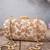 Beige embroidered ada capsule clutch