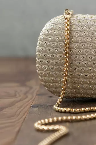 Champagne light gold capsule clutch