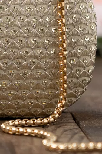 Champagne light gold capsule clutch