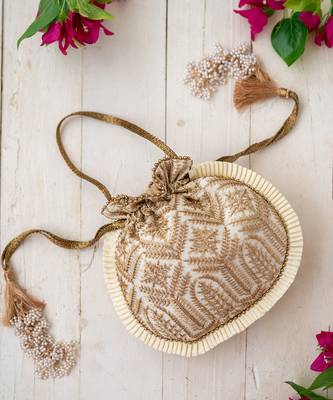 Cream leela heritage potli bag 1