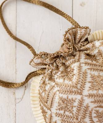 Cream leela heritage potli bag 2