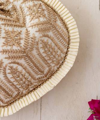 Cream leela heritage potli bag 3