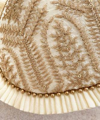 Cream leela heritage potli bag 4