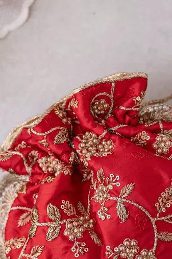 Red embroidered pearl potli bag